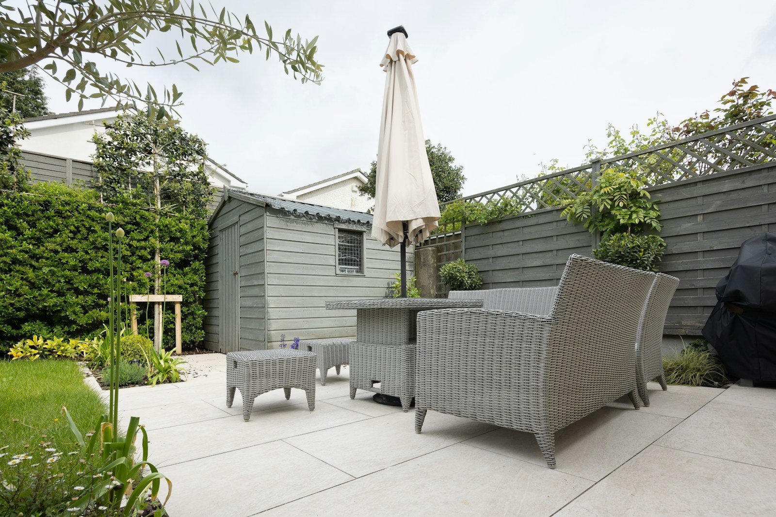 An inviting landscaped backyard with planting and outdoor living space